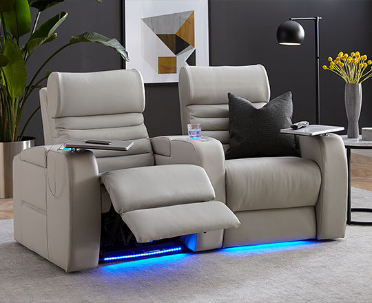Two grey home theatre seats reclining