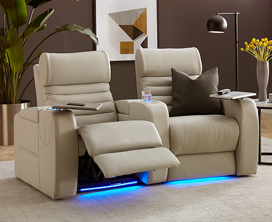 Two grey home theatre seats reclining