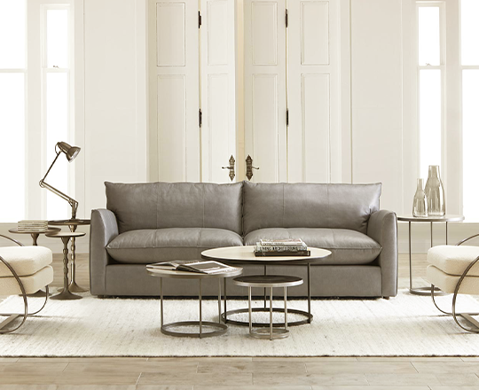 Grey leather sofa in white living room