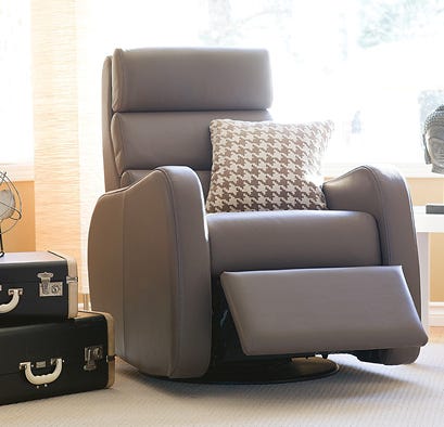 Contemporary beige recliner, reclined in a living room