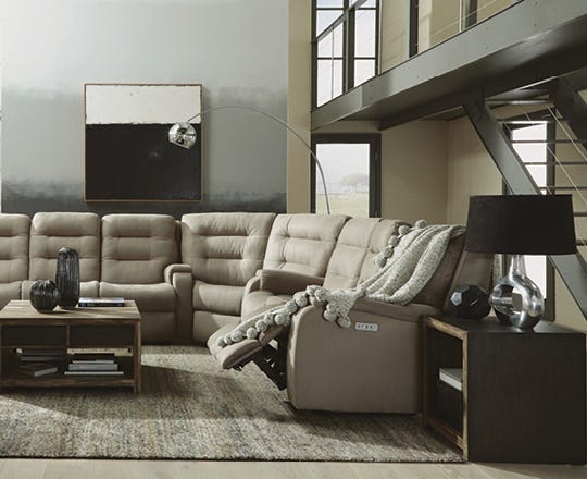 Contemporary beige reclining sectional in a living room