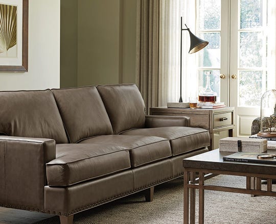 Grey leather sofa in white living room