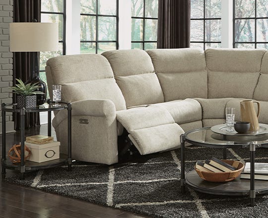 Contemporary beige reclining sectional in a living room