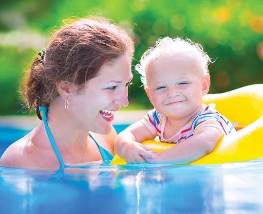 Kids swimming in a pool 