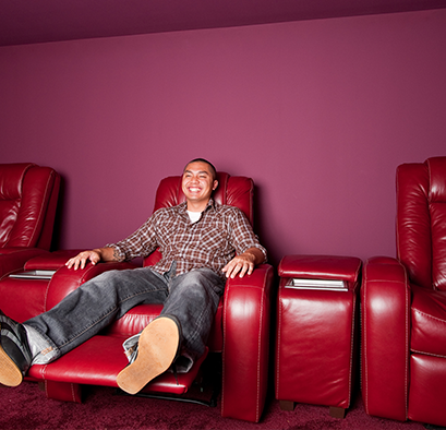 Red leather home theater set in media room