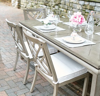 Outdoor dining set on a brick patio