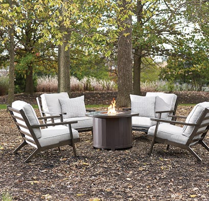 Outdoor patio furniture set in a backyard