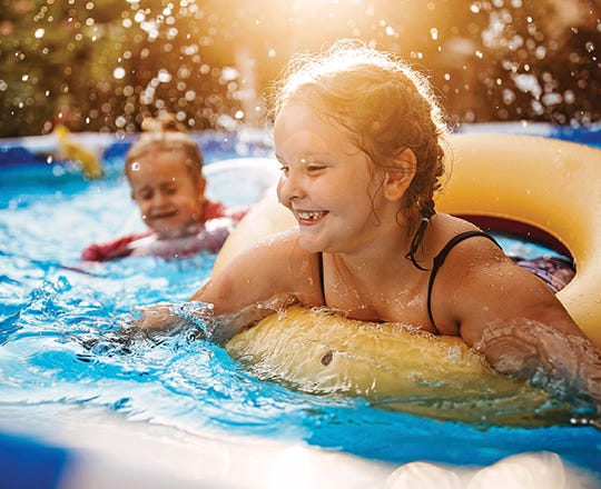 Kids swimming in a pool 