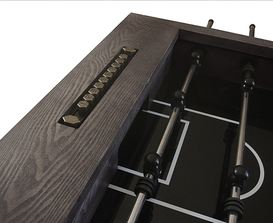 Closeup of a reclaimed style foosball table in grey-washed color 