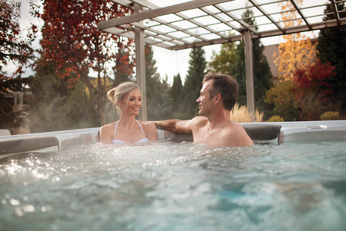 Couple sitting in spa during autumn 
