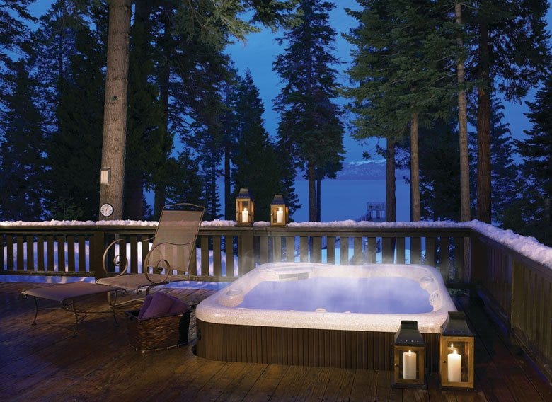 Spa with built-in deck on a snowy landscape
